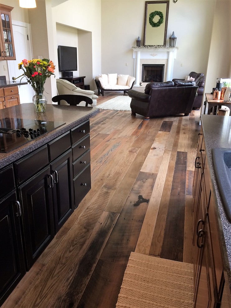 Photo of a living room in Louisville with medium hardwood floors.