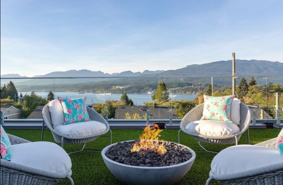 Design ideas for a contemporary back patio in Vancouver with a fire feature and no cover.