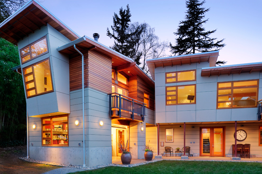 Photo of a large contemporary two-storey concrete grey exterior in Seattle with a flat roof.