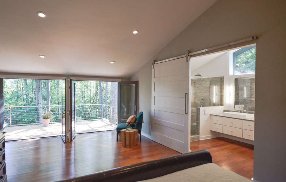 Mid-sized transitional master bedroom in Atlanta with grey walls, dark hardwood floors, no fireplace and brown floor.