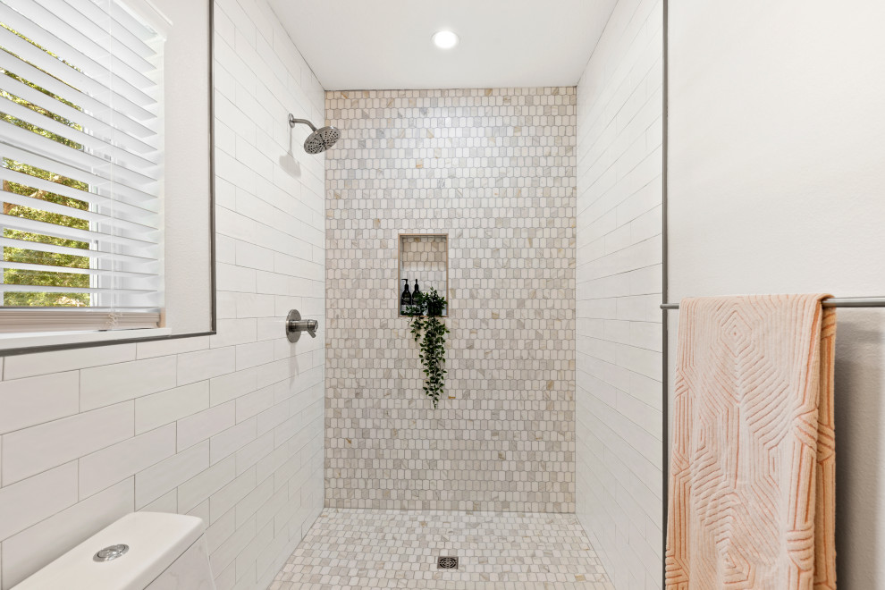 Inspiration for a small midcentury master bathroom in Tampa with furniture-like cabinets, medium wood cabinets, an open shower, a one-piece toilet, white tile, subway tile, white walls, vinyl floors, an integrated sink, a shower curtain, a niche, a double vanity and a floating vanity.