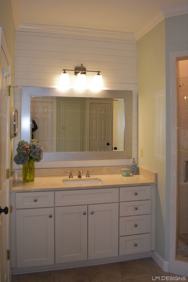 Mid-sized transitional master white tile and subway tile ceramic tile and beige floor alcove bathtub photo with recessed-panel cabinets, white cabinets, green walls, an undermount sink, marble countertops, a hinged shower door and beige countertops