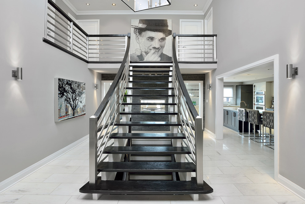 Inspiration for a large contemporary wood straight staircase in Toronto with open risers.