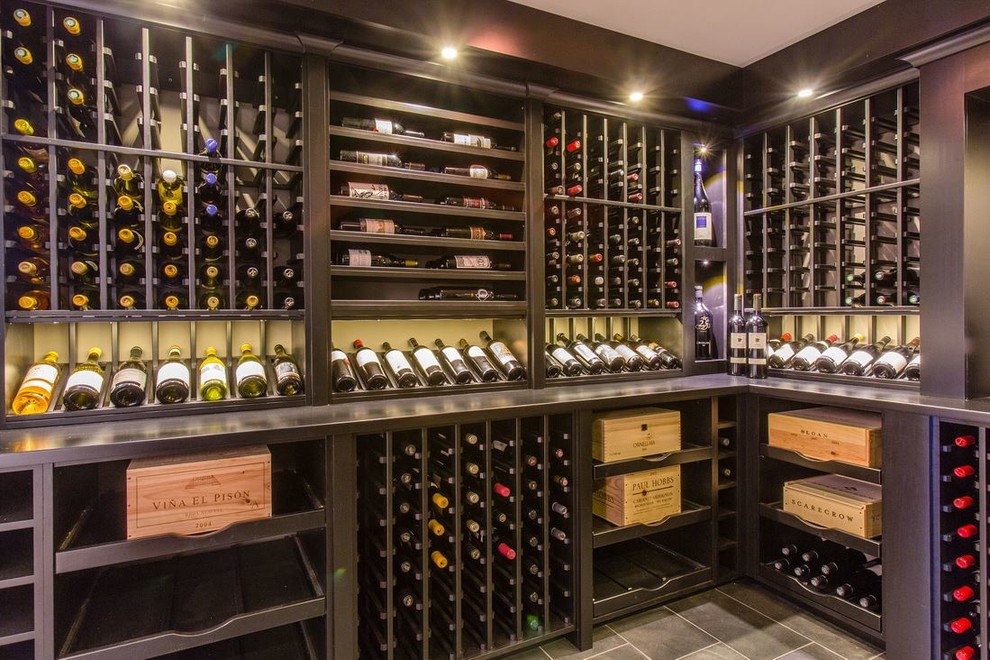 Mid-sized contemporary wine cellar in Boston with ceramic floors and storage racks.