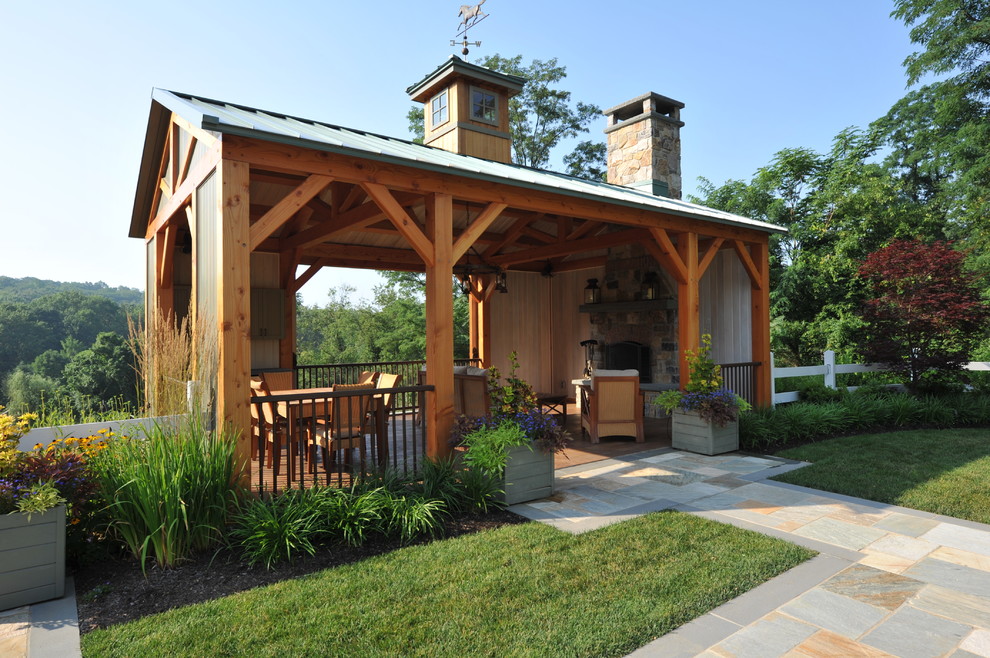 Design ideas for a large country backyard deck in New York with a fire feature and a pergola.
