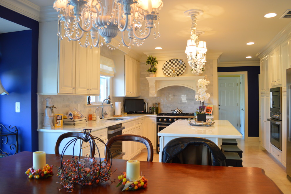 Inspiration for a large traditional u-shaped eat-in kitchen in New York with an undermount sink, raised-panel cabinets, white cabinets, quartzite benchtops, grey splashback, subway tile splashback, stainless steel appliances, with island, ceramic floors and beige floor.