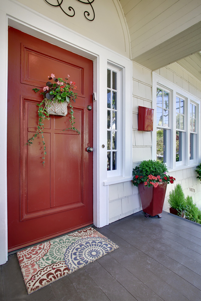 Photo of a traditional front door in Seattle with a single front door and a red front door.