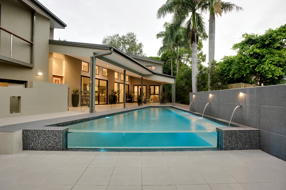 Contemporary rectangular pool in Brisbane with concrete pavers.