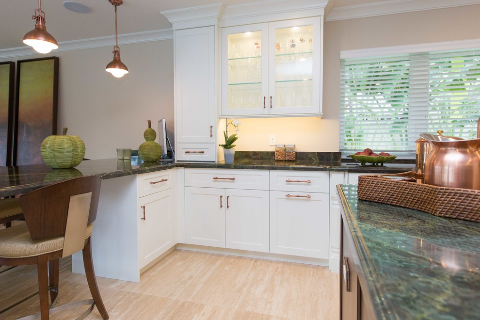 Inspiration for a large transitional u-shaped light wood floor open concept kitchen remodel in Miami with a farmhouse sink, shaker cabinets, stainless steel appliances, an island, white cabinets, granite countertops, metallic backsplash and mosaic tile backsplash