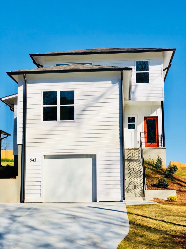 Mid-sized minimalist white two-story house exterior photo in Atlanta