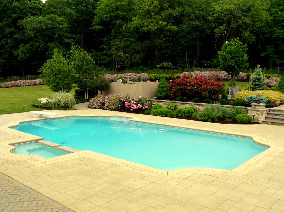 Design ideas for a large rectangular pool in New York with stamped concrete.