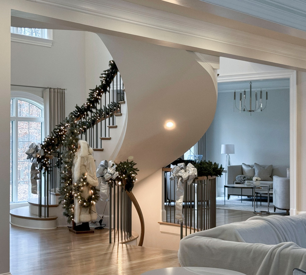 Inspiration for a large timeless wooden floating mixed material railing staircase remodel in DC Metro with painted risers