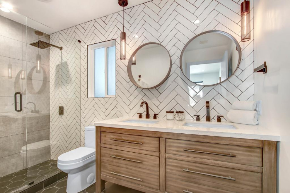 Mid-sized transitional master white tile and ceramic tile ceramic tile, gray floor, double-sink, wallpaper ceiling and wallpaper doorless shower photo in Los Angeles with recessed-panel cabinets, medium tone wood cabinets, a one-piece toilet, white walls, an undermount sink, quartz countertops, a hinged shower door, white countertops and a floating vanity