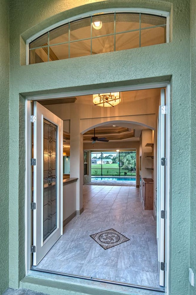 Example of a transitional home design design in Miami