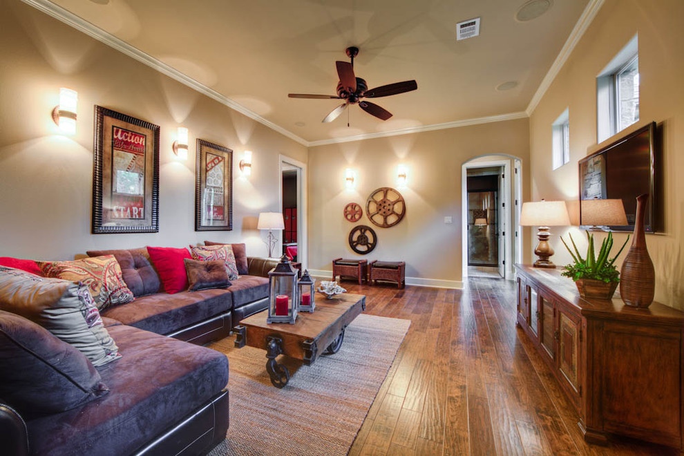 This is an example of a mediterranean family room in Austin with brown floor.