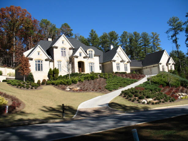Inspiration for an expansive asian two-storey white house exterior in Atlanta with stone veneer, a gable roof and a shingle roof.