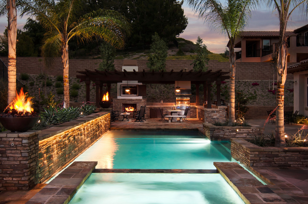 Inspiration for a mid-sized transitional backyard tile and rectangular lap hot tub remodel in Orange County