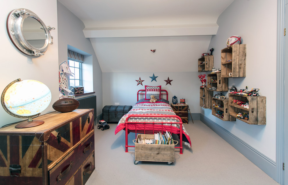 Photo of a large transitional kids' bedroom for kids 4-10 years old and boys in Surrey with carpet, grey floor and white walls.