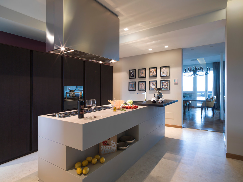 Large contemporary single-wall open plan kitchen in Other with flat-panel cabinets, white cabinets and with island.
