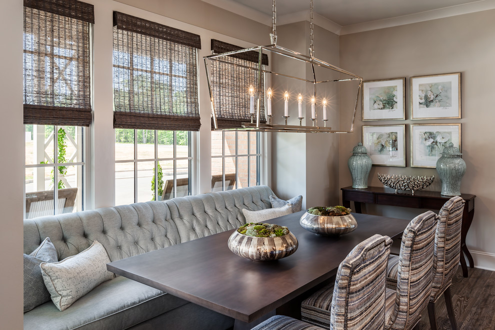 Example of a mid-sized medium tone wood floor and brown floor kitchen/dining room combo design with gray walls