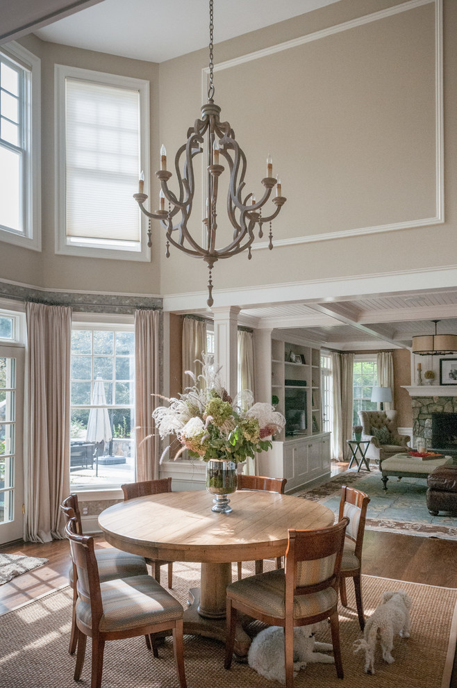 Inspiration for a mid-sized traditional dining room in New York with beige walls and dark hardwood floors.