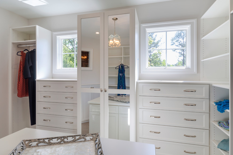 Design ideas for a transitional walk-in wardrobe in Richmond with recessed-panel cabinets and white cabinets.