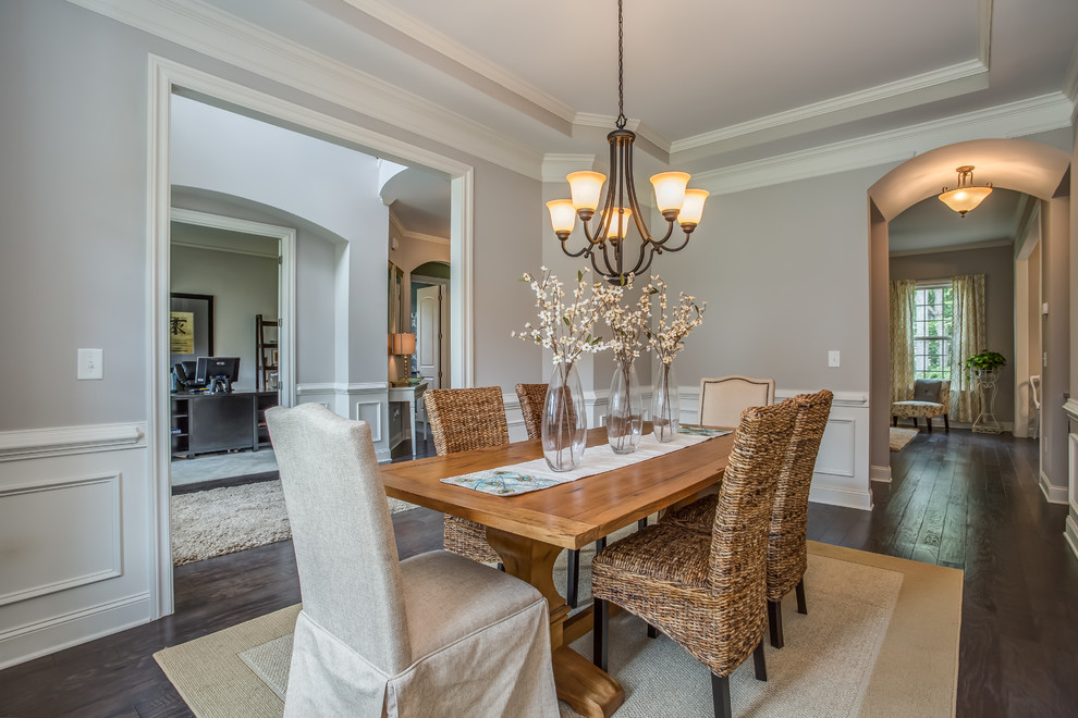Large traditional separate dining room in Atlanta with grey walls and dark hardwood floors.