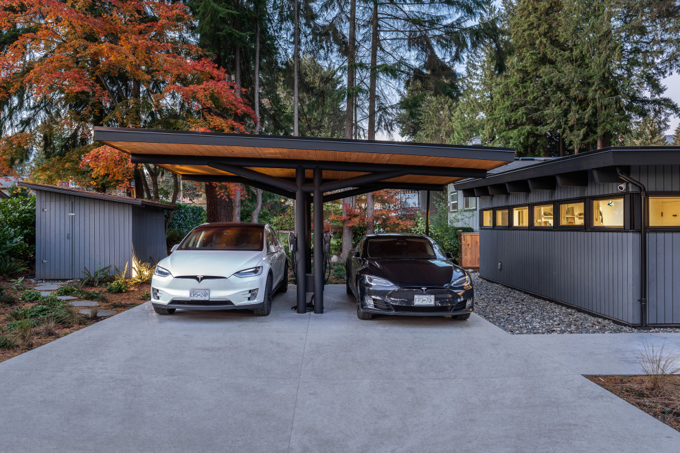 Photo of a mid-sized midcentury garage in Vancouver.