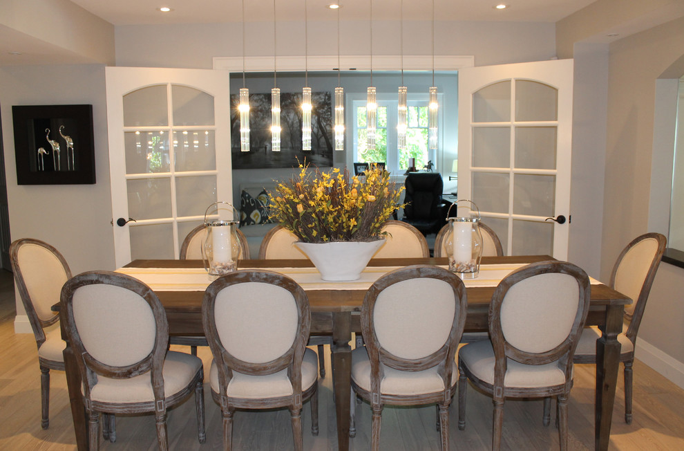 Photo of a beach style dining room in Toronto with grey walls.
