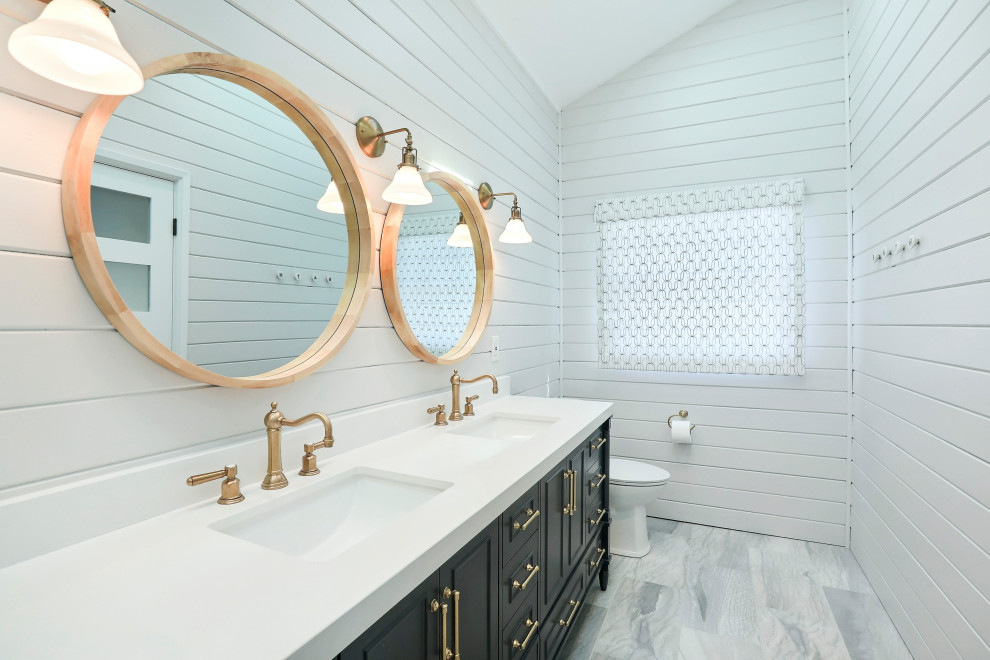 Design ideas for a mid-sized beach style master bathroom in Other with blue cabinets, a freestanding tub, a curbless shower, white walls, an undermount sink, engineered quartz benchtops, grey floor, an open shower, white benchtops, a double vanity and a freestanding vanity.