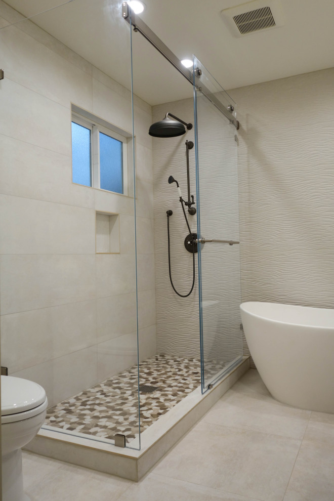 Mid-sized contemporary master bathroom in San Francisco with louvered cabinets, brown cabinets, a freestanding tub, a corner shower, a two-piece toilet, white tile, porcelain tile, white walls, porcelain floors, an undermount sink, marble benchtops, brown floor, a sliding shower screen and white benchtops.
