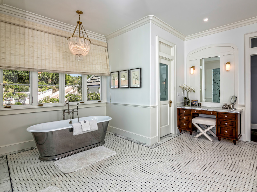Large traditional master bathroom in Los Angeles with a freestanding tub, dark wood cabinets, white walls, mosaic tile floors, grey floor, grey benchtops and beaded inset cabinets.