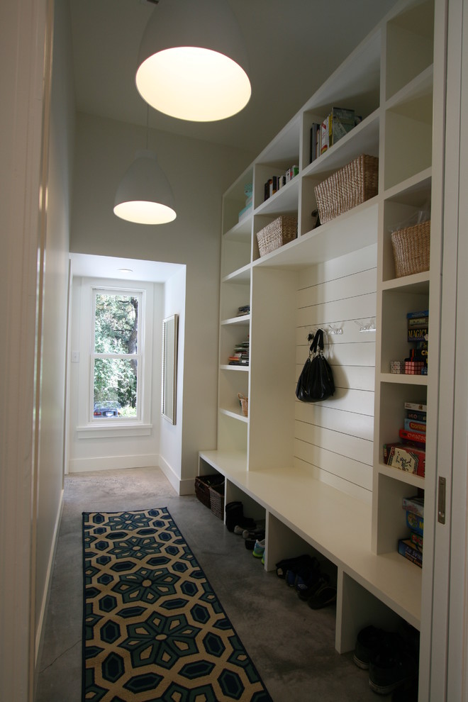 Design ideas for a contemporary mudroom in Austin with white walls.