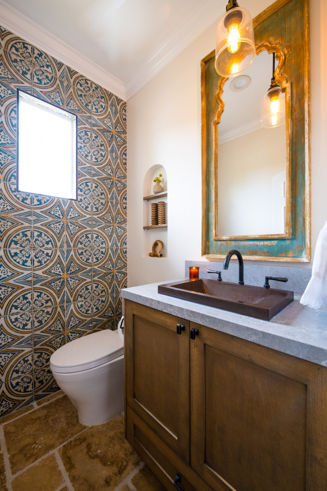 Inspiration for a mediterranean cloakroom in San Diego with a feature wall.