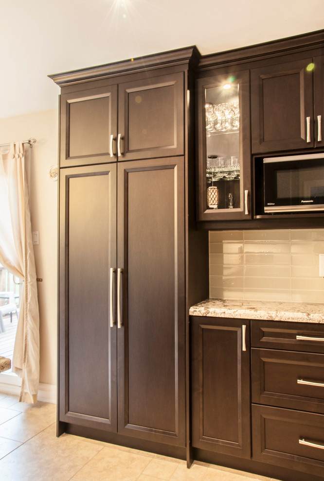 Example of a transitional kitchen design in Toronto