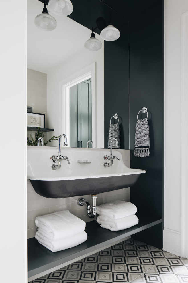Inspiration for a large classic family bathroom in Chicago with black walls, a wall-mounted sink, multi-coloured floors and double sinks.