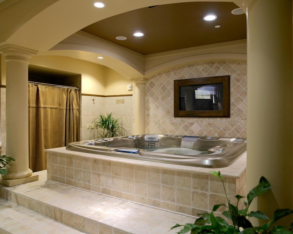 This is an example of a small traditional indoor custom-shaped pool in Houston with a hot tub and tile.