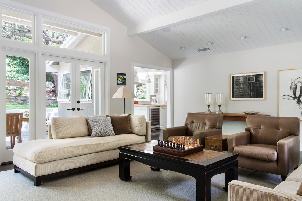 Example of a transitional family room design in Los Angeles with white walls