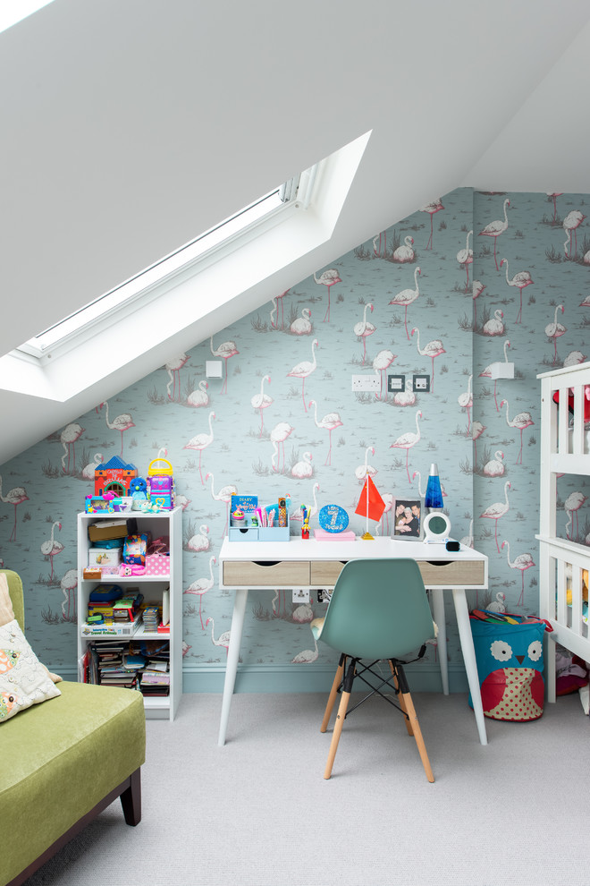 Contemporary gender-neutral kids' bedroom in London with multi-coloured walls, carpet and grey floor for kids 4-10 years old.