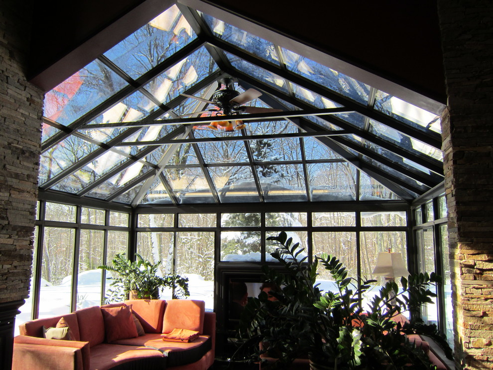 Inspiration for a large traditional sunroom in New York with medium hardwood floors, no fireplace and a skylight.