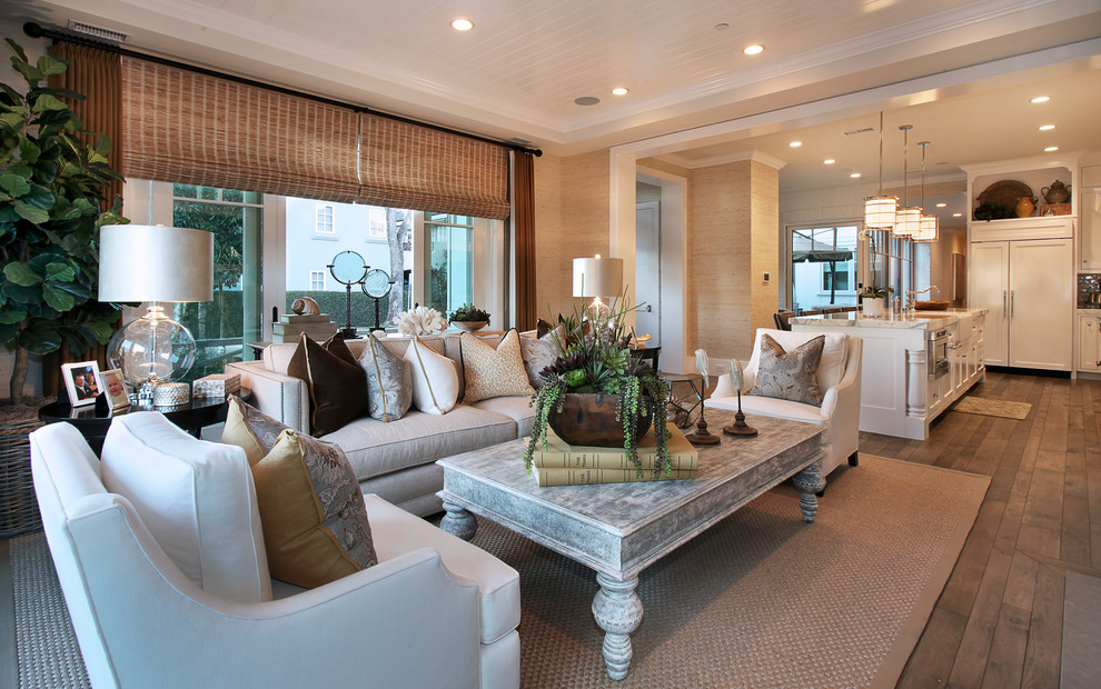 Design ideas for a traditional open concept living room in Orange County with beige walls.