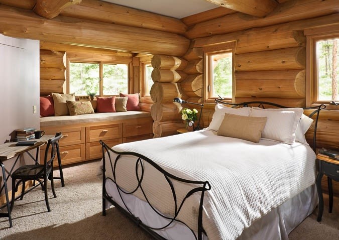 This is an example of a country bedroom in Boise.