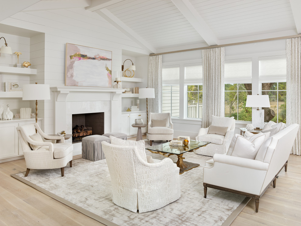 Design ideas for a mid-sized transitional formal open concept living room in Charleston with white walls, light hardwood floors, a standard fireplace, a stone fireplace surround, beige floor and timber.