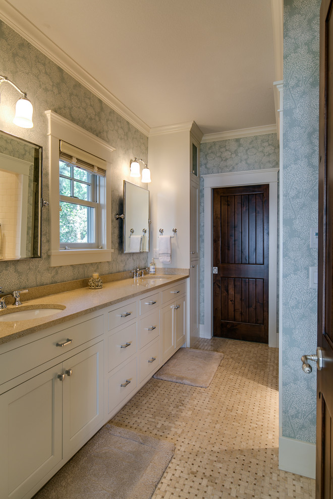 Design ideas for a mid-sized traditional master bathroom in Minneapolis with recessed-panel cabinets, white cabinets, an alcove shower, a two-piece toilet, white tile, subway tile, blue walls, marble floors, an undermount sink, engineered quartz benchtops, beige floor, a hinged shower door and beige benchtops.