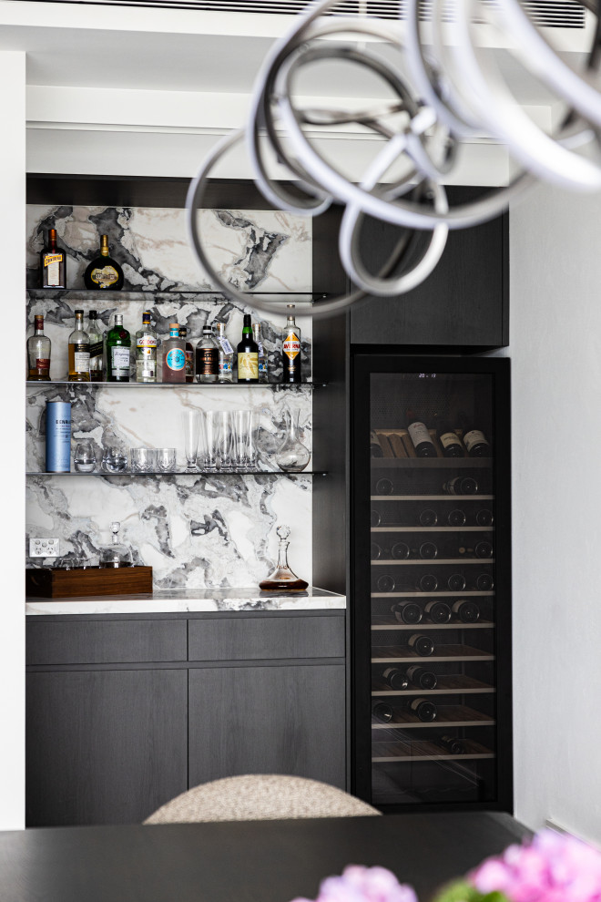 This is an example of a small contemporary dry bar in Other with dark wood cabinets, marble worktops, multi-coloured splashback, marble splashback, dark hardwood flooring, multicoloured worktops and open cabinets.