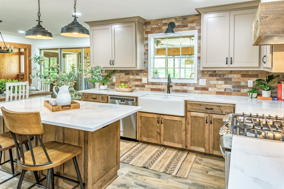 Inspiration for a mid-sized rustic u-shaped porcelain tile and brown floor eat-in kitchen remodel with an undermount sink, shaker cabinets, medium tone wood cabinets, quartzite countertops, multicolored backsplash, porcelain backsplash, stainless steel appliances, an island and white countertops