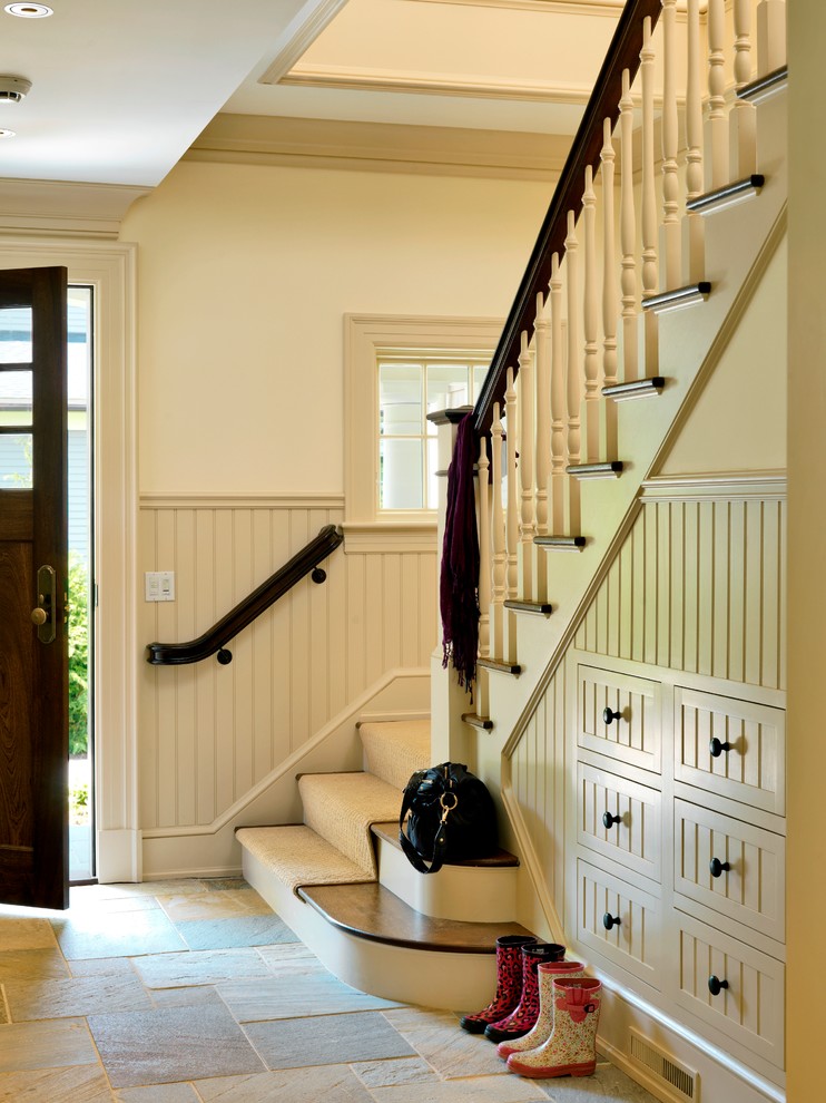 Design ideas for a mid-sized traditional mudroom in Boston with white walls, a single front door and a dark wood front door.