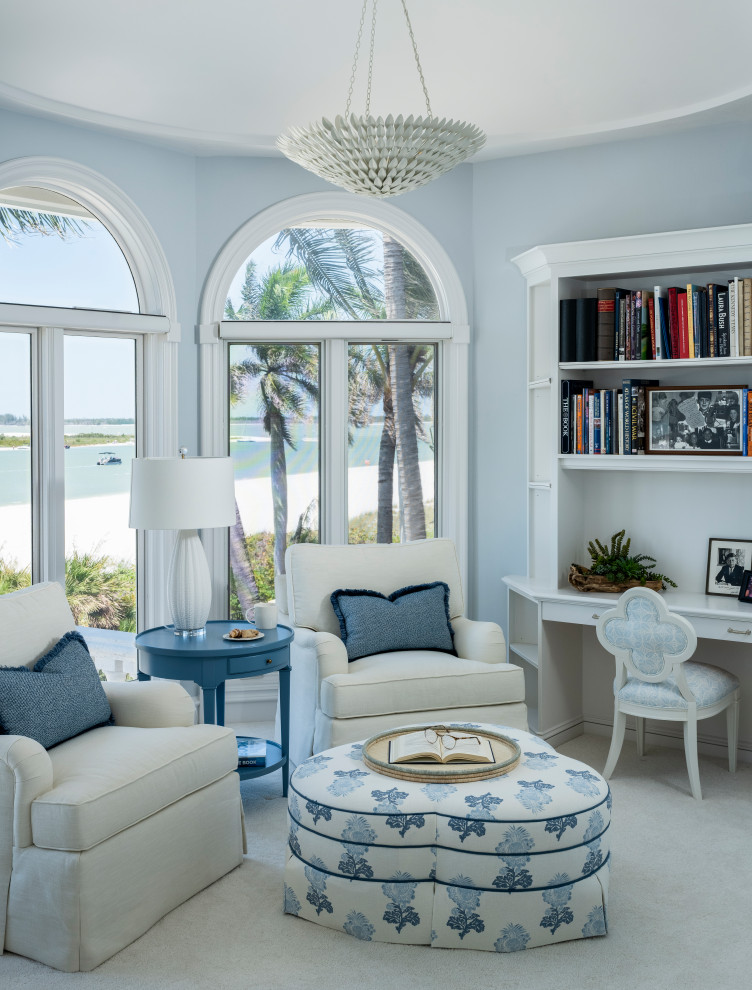Example of a large transitional built-in desk and master carpeted and white floor bedroom design with blue walls