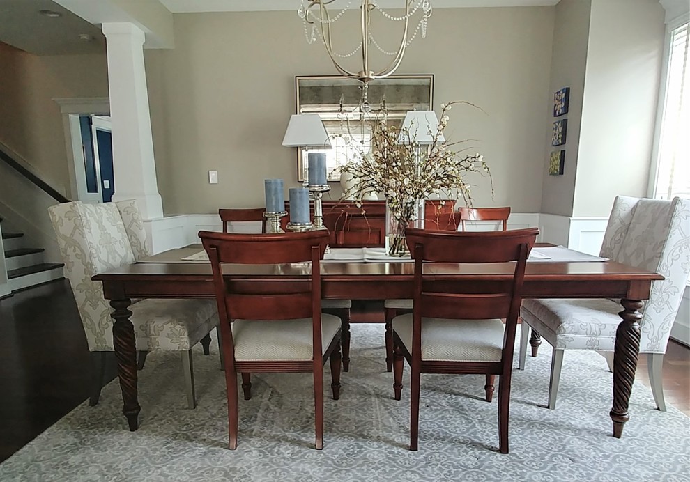 Mid-sized transitional separate dining room in DC Metro with grey walls, dark hardwood floors and brown floor.