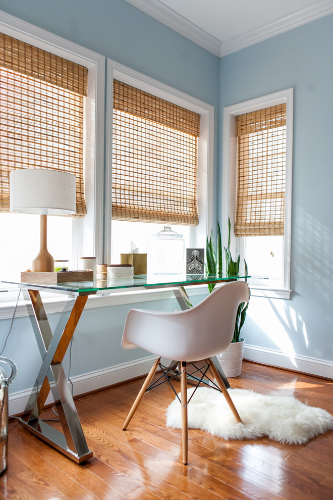 Home office - mid-sized transitional freestanding desk brown floor home office idea in Baltimore with blue walls